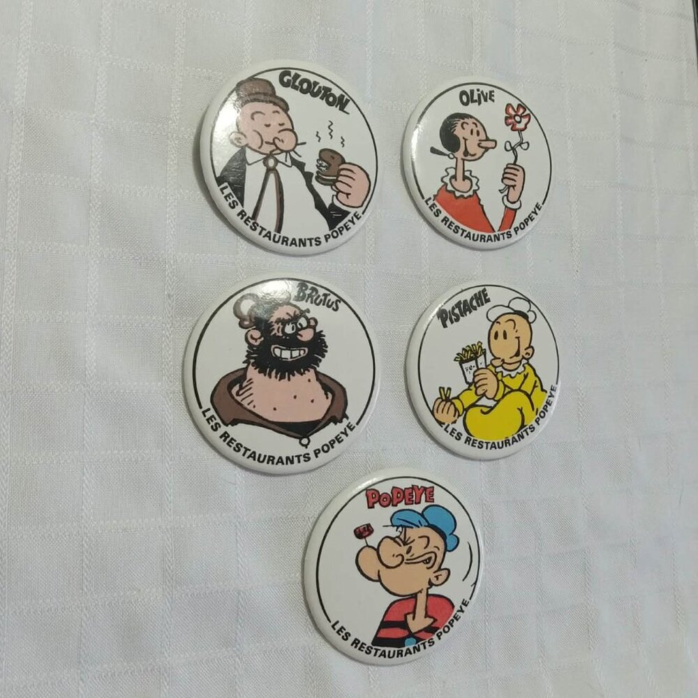 Five strange & unusual vintage button pins featuring Popeye and cie